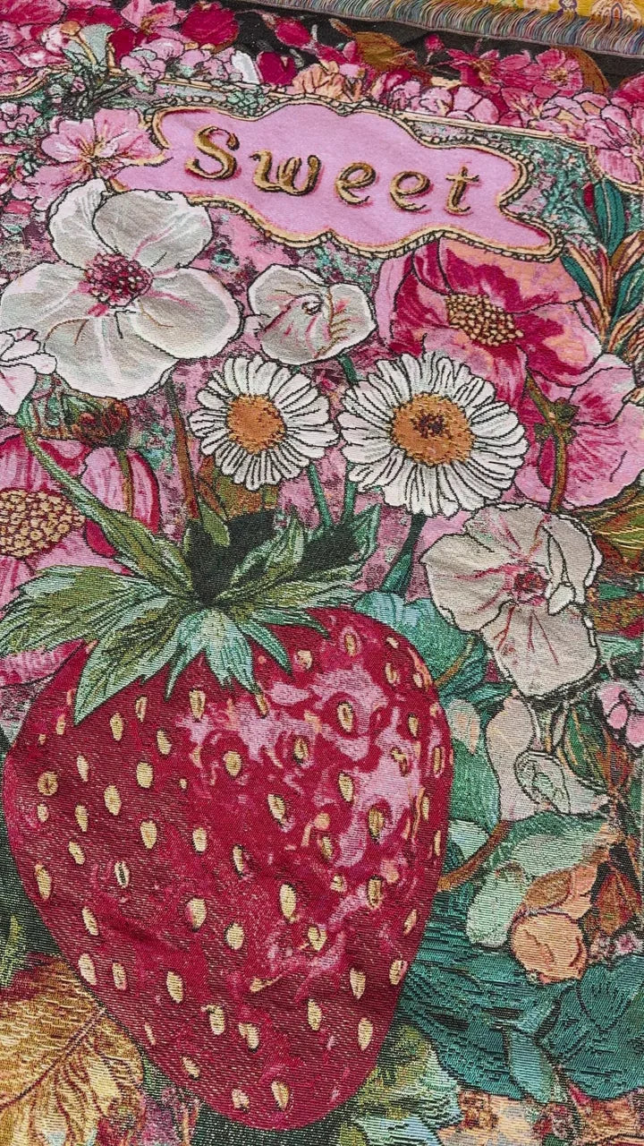 Close view of the actual woven version showing the same Sweet lettering, flowers and strawberry