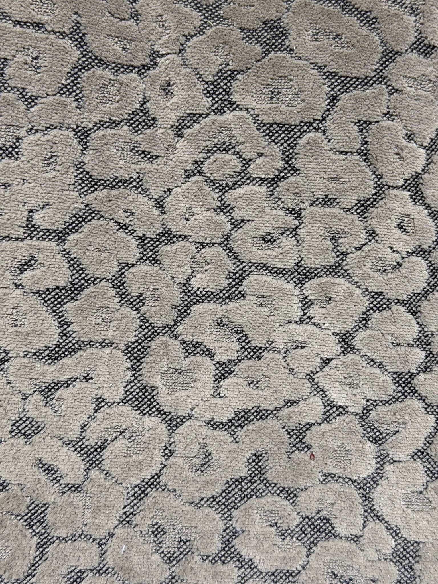 Animal-spot cut velvet jacquard pile face in a neutral colorway