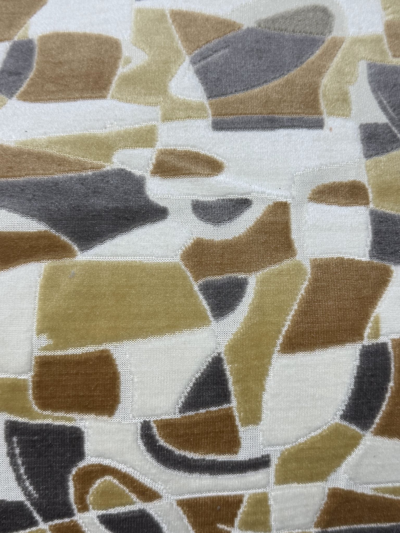 Drape of earth-tone geometric cut velvet jacquard