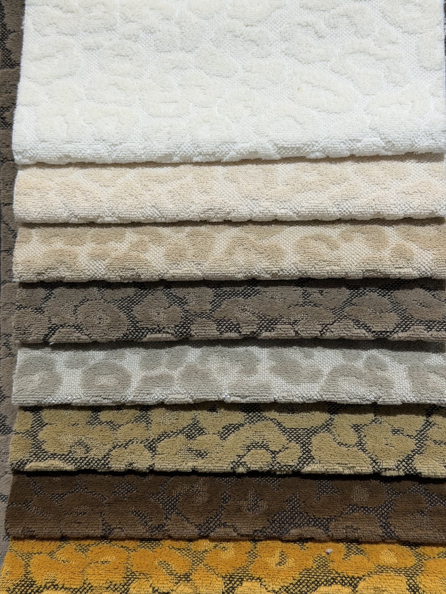 Swatch stack of animal-spot cut velvet jacquard