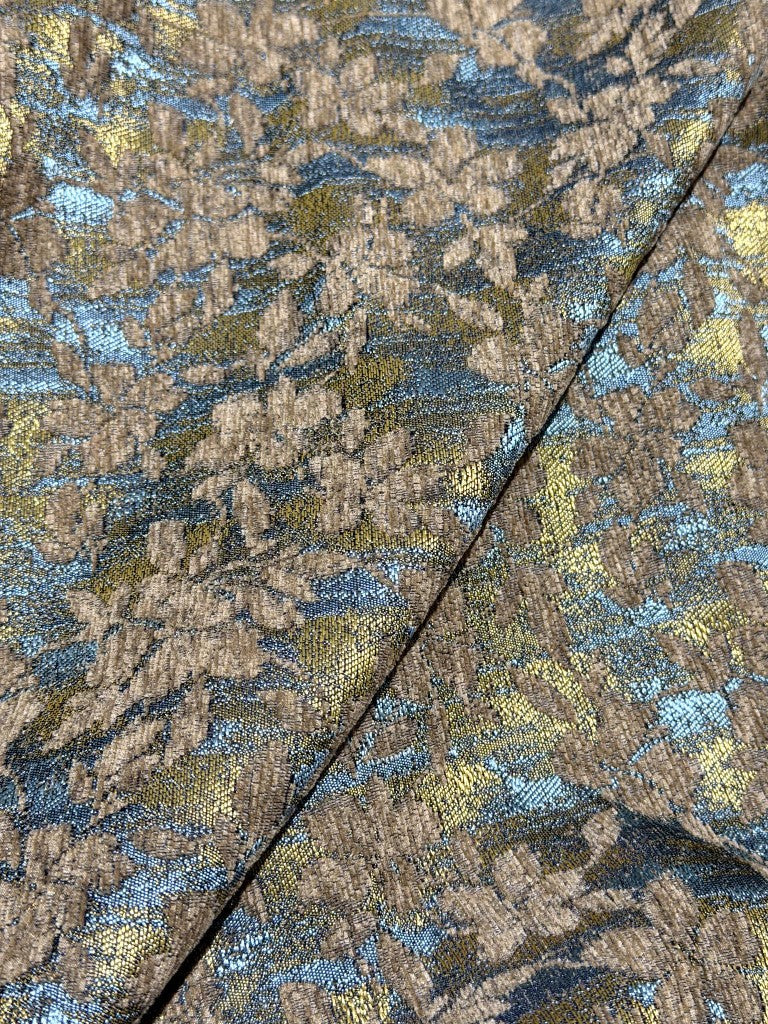 Fold detail of blue-gold mid-century chenille jacquard fabric