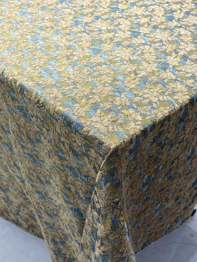 Corner detail of blue-gold leaf chenille jacquard weave