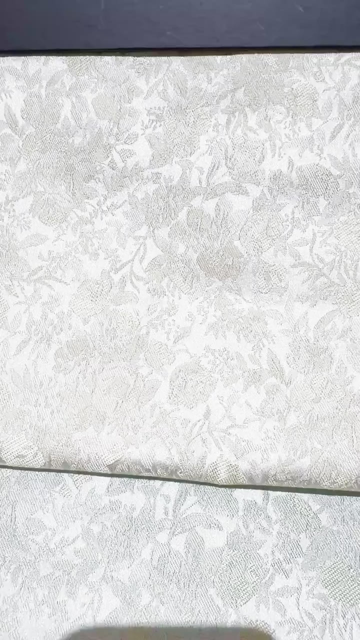 Songjin-style floral brocade jacquard fabric roll detail video showing woven sheen and pattern scale