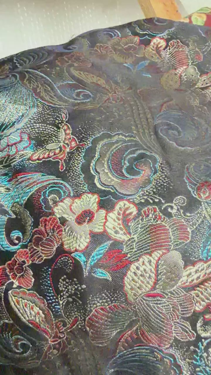 Songjin-style floral paisley brocade jacquard fabric video showing satin-like sheen and lightweight hand feel