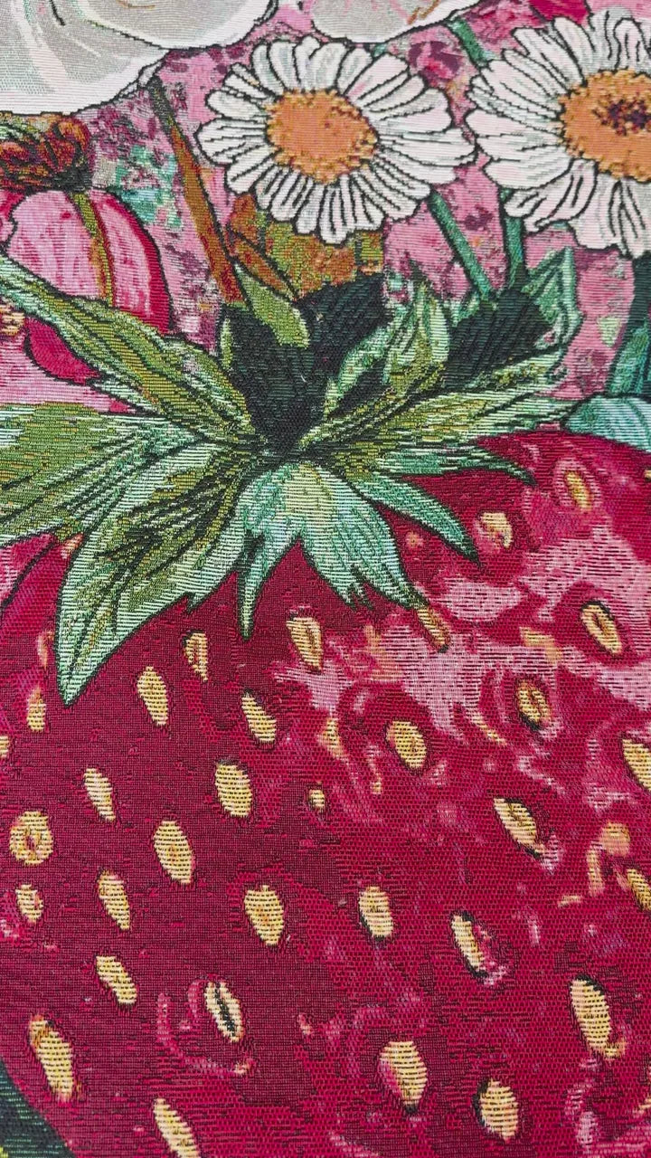 Strawberry seeds, red shading and pale highlights in the woven sample